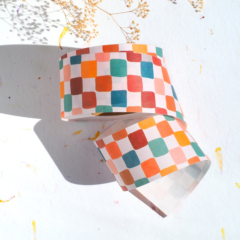 Colorful checkered water-activated packing tape made with paper to decorate shipping boxes